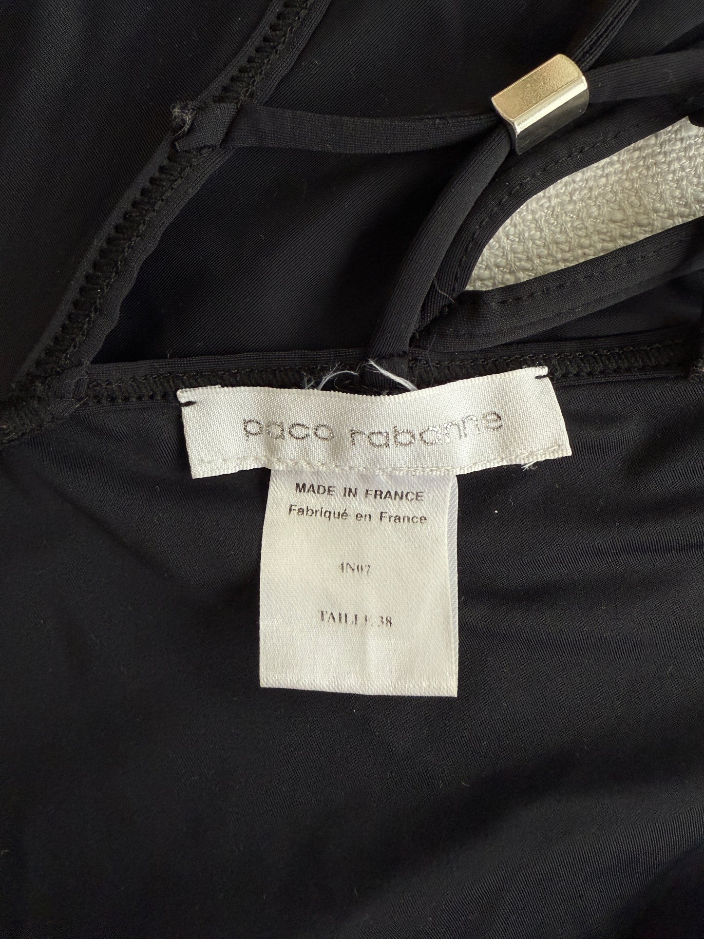 A close-up image of the size and brand label of the vintage Paco Rabanne swim Suit