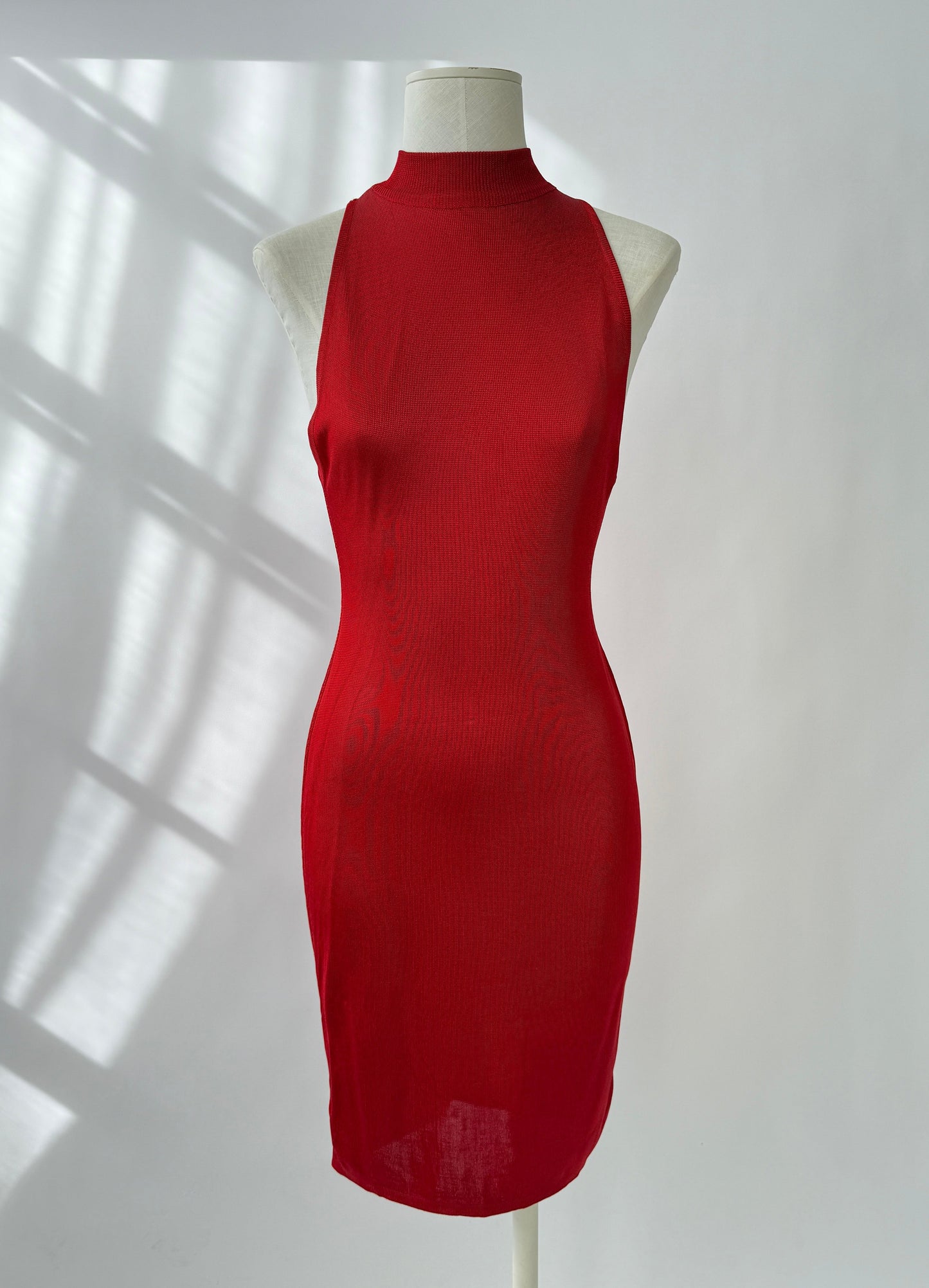 Front side view of the rare and vintage 1986 Azzedine Alaia dress on a mannequin.