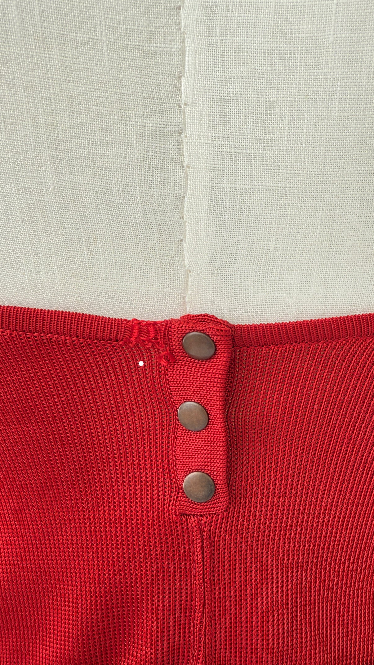 Close up of the back of the Azzedine Alaia vintage red skirt and bodysuit set.
