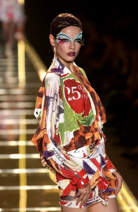 Christian Dior by John Galliano S/S 2003 "Victim" Draped Top on the runway on a model.