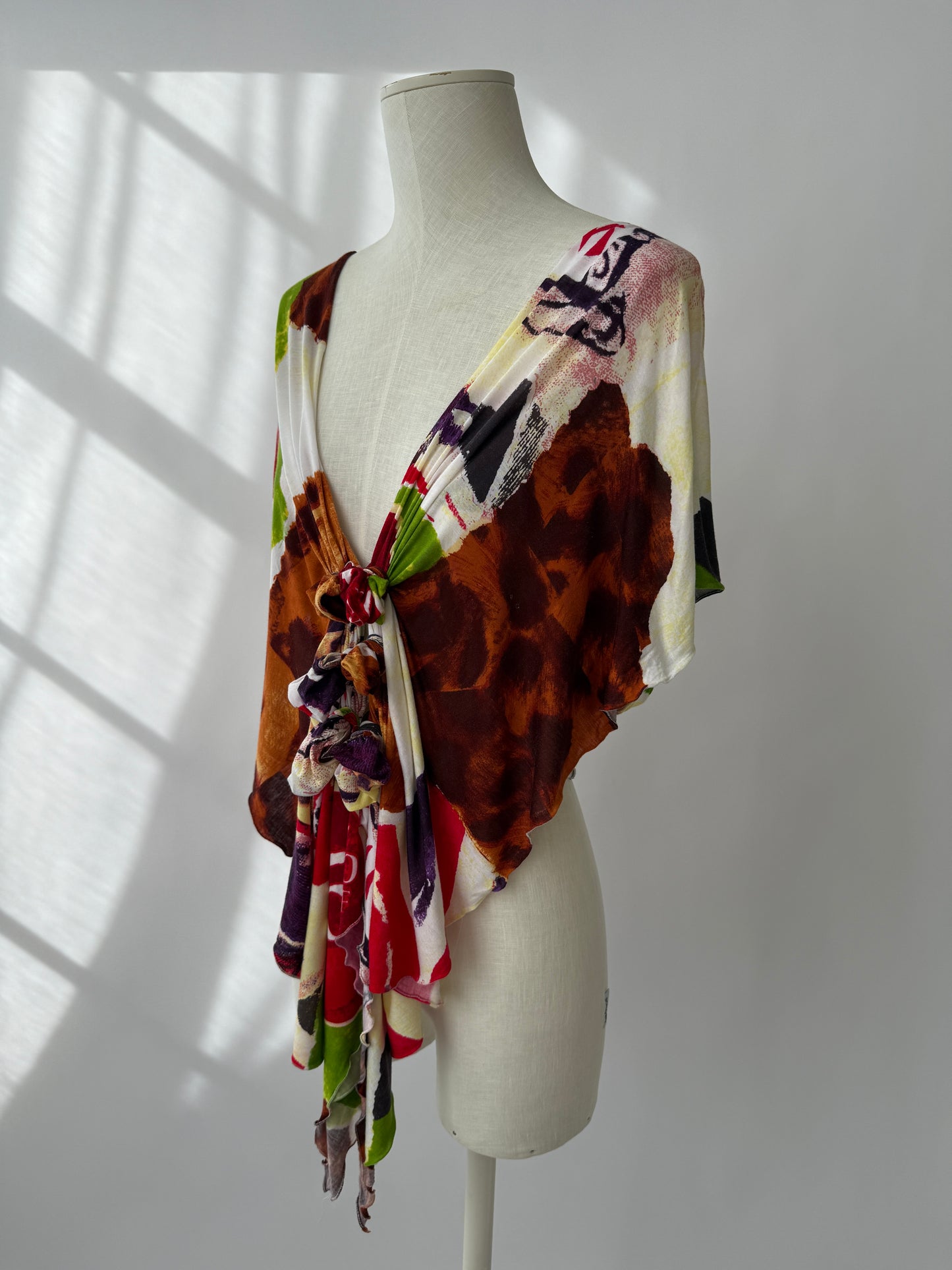 Side view of the Christian Dior by John Galliano top on a mannequin.
