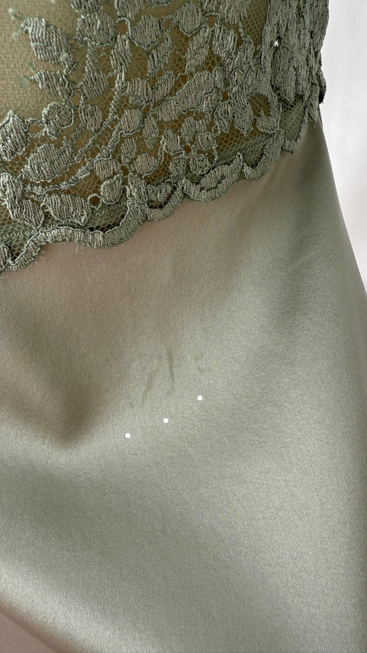 Detail photo of the fabric of the La Perla Mini Slip Dress in pastel green