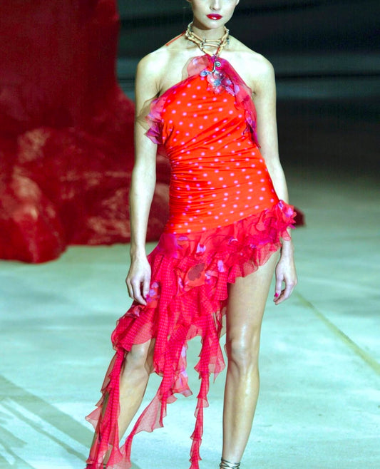 Model at the Emanuel Ungaro Spring/Summer 2003 show wearing the red polka-dot ruffle halter dress, seen from mid-angle with lighting that reveals fabric texture.