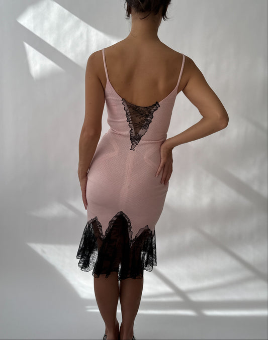 Back view of vintage Versace 2002 dress showing open back and lace fishtail hem.