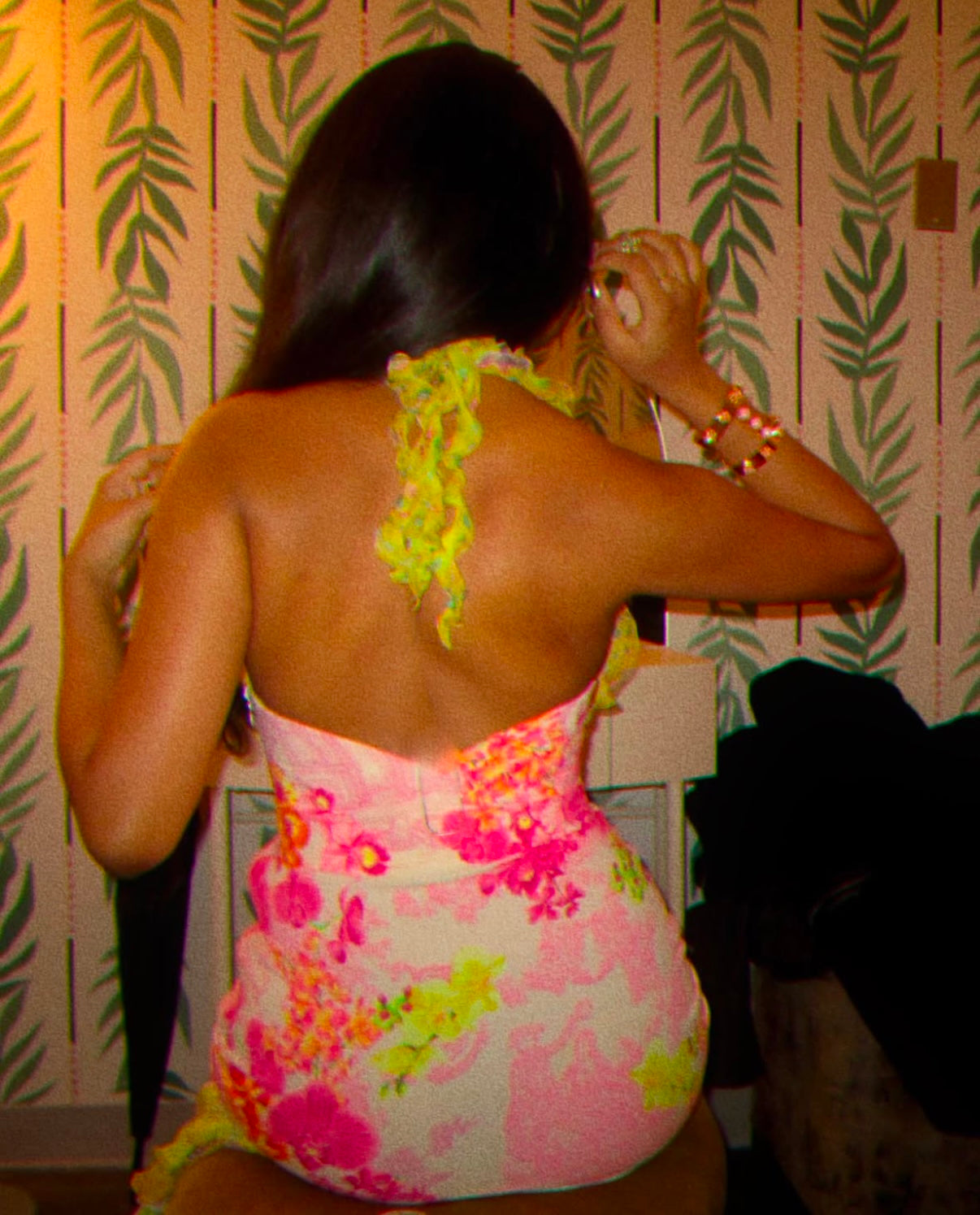 Avantika wearing the Versace 2004 vintage ruffled silk dress with ruffle halter straps