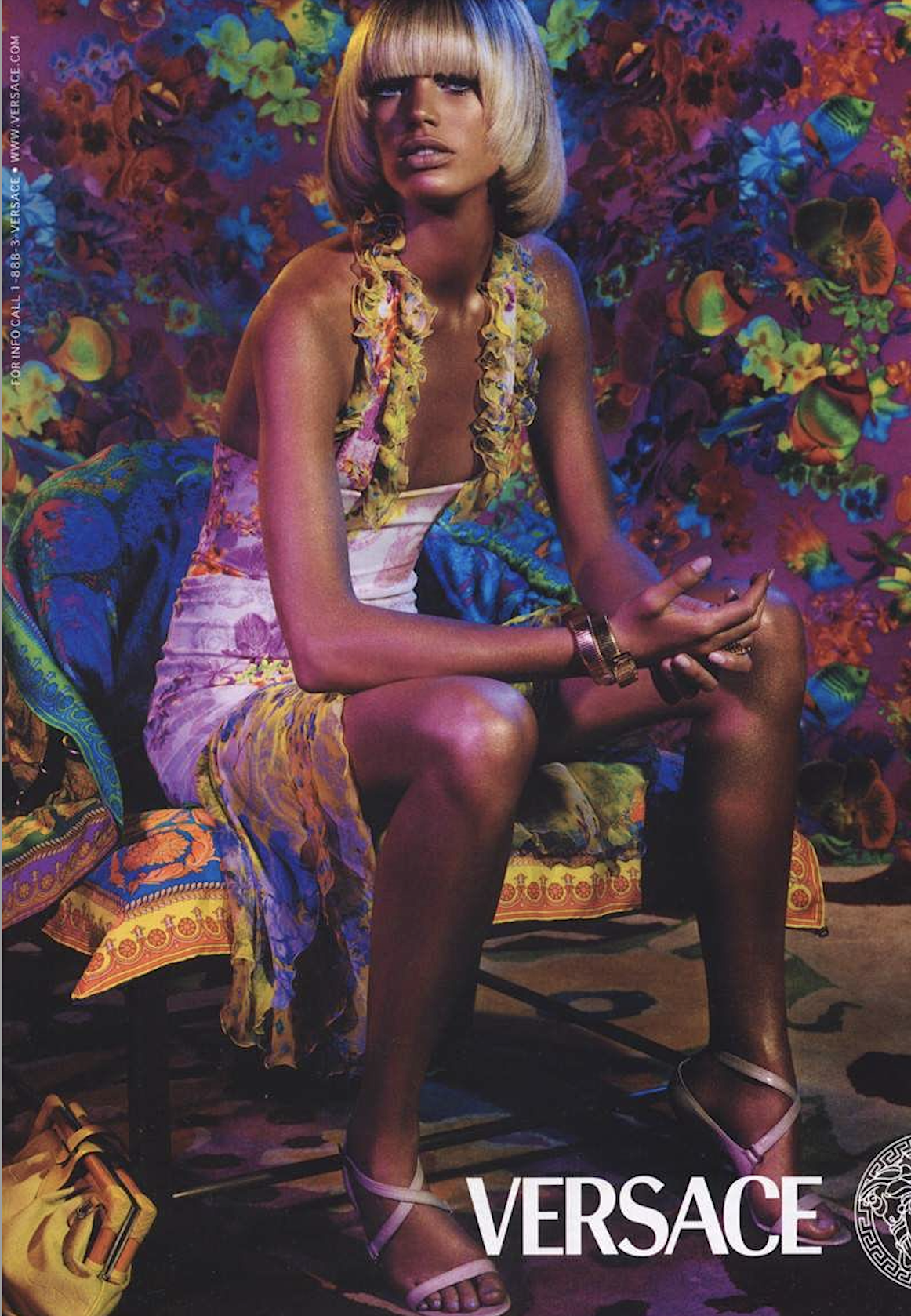 Campaign image featuring the asymmetric ruffled silk plunging dress from the Versace SS 2004 collection.