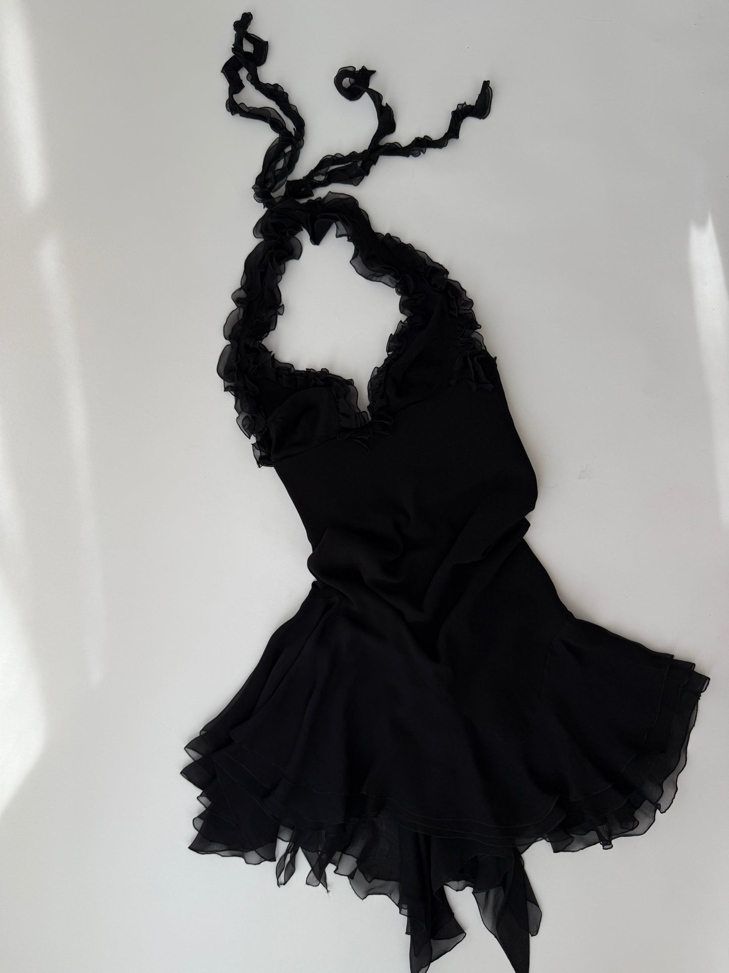 Flat lay image of the lightweight silk vintage Versace dress.