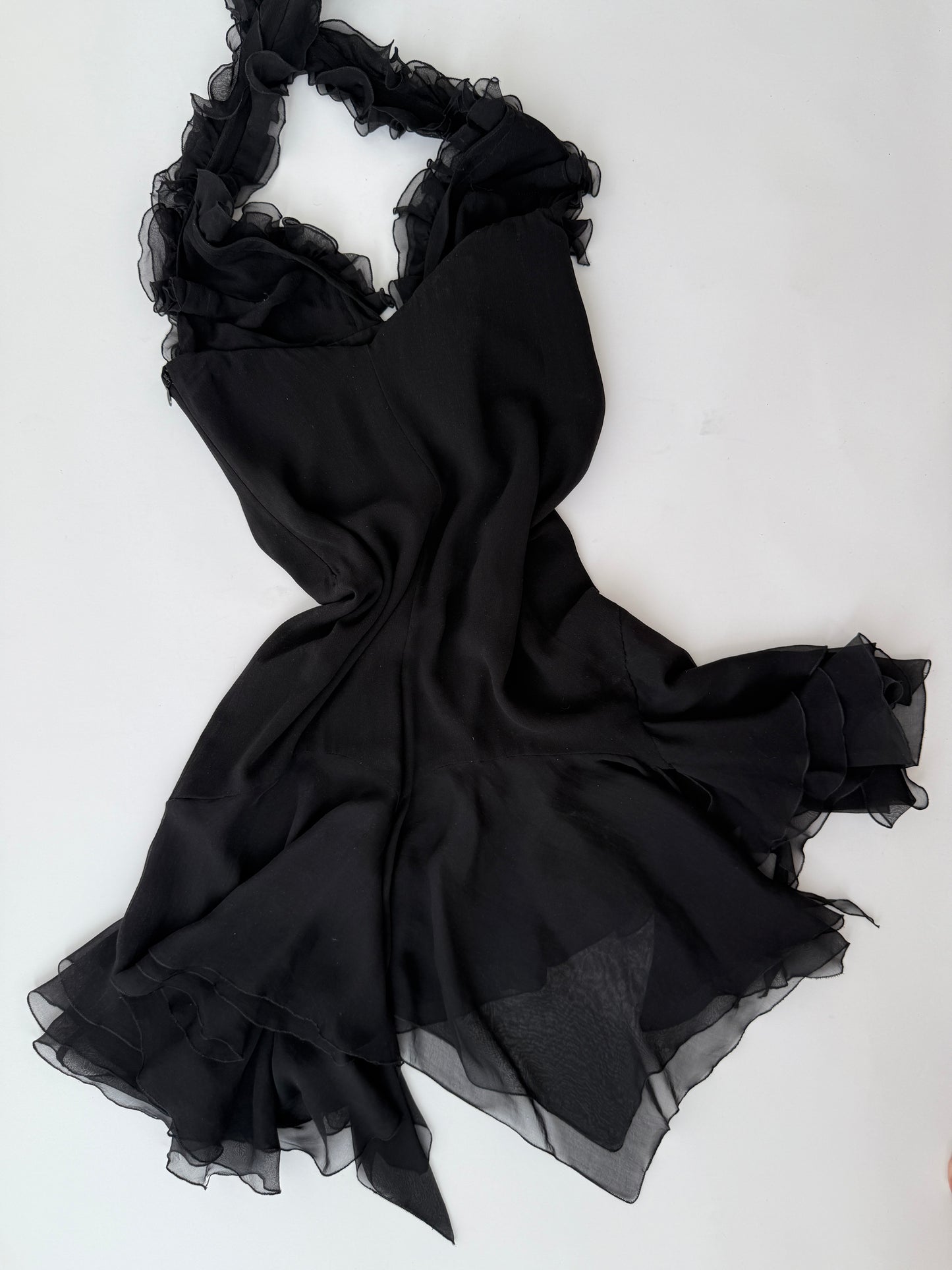Detail shot of the lightweight silk texture and stitching of the vintage Versace dress.