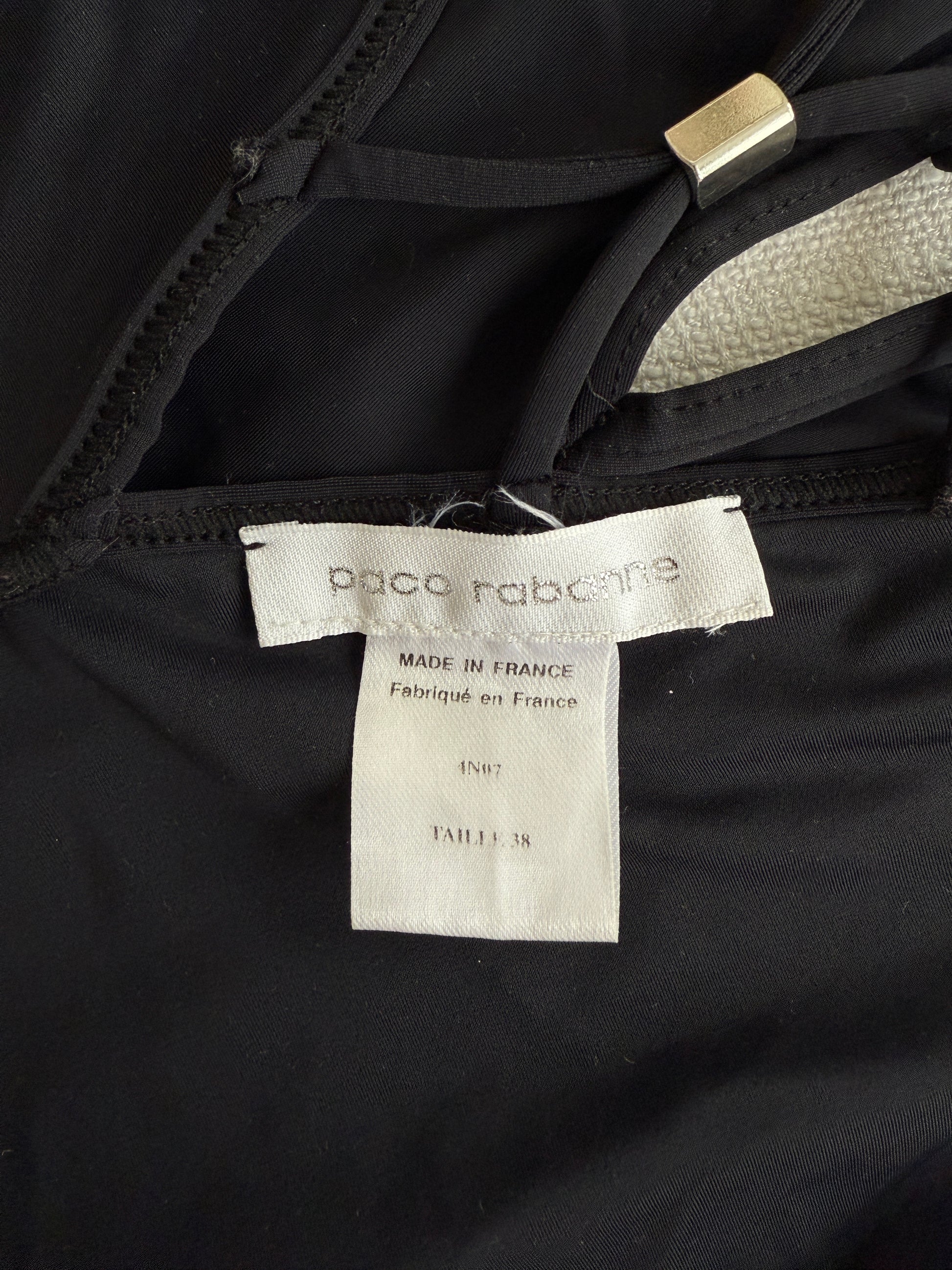 A close-up image of the size and brand label of the vintage Paco Rabanne swim Suit 