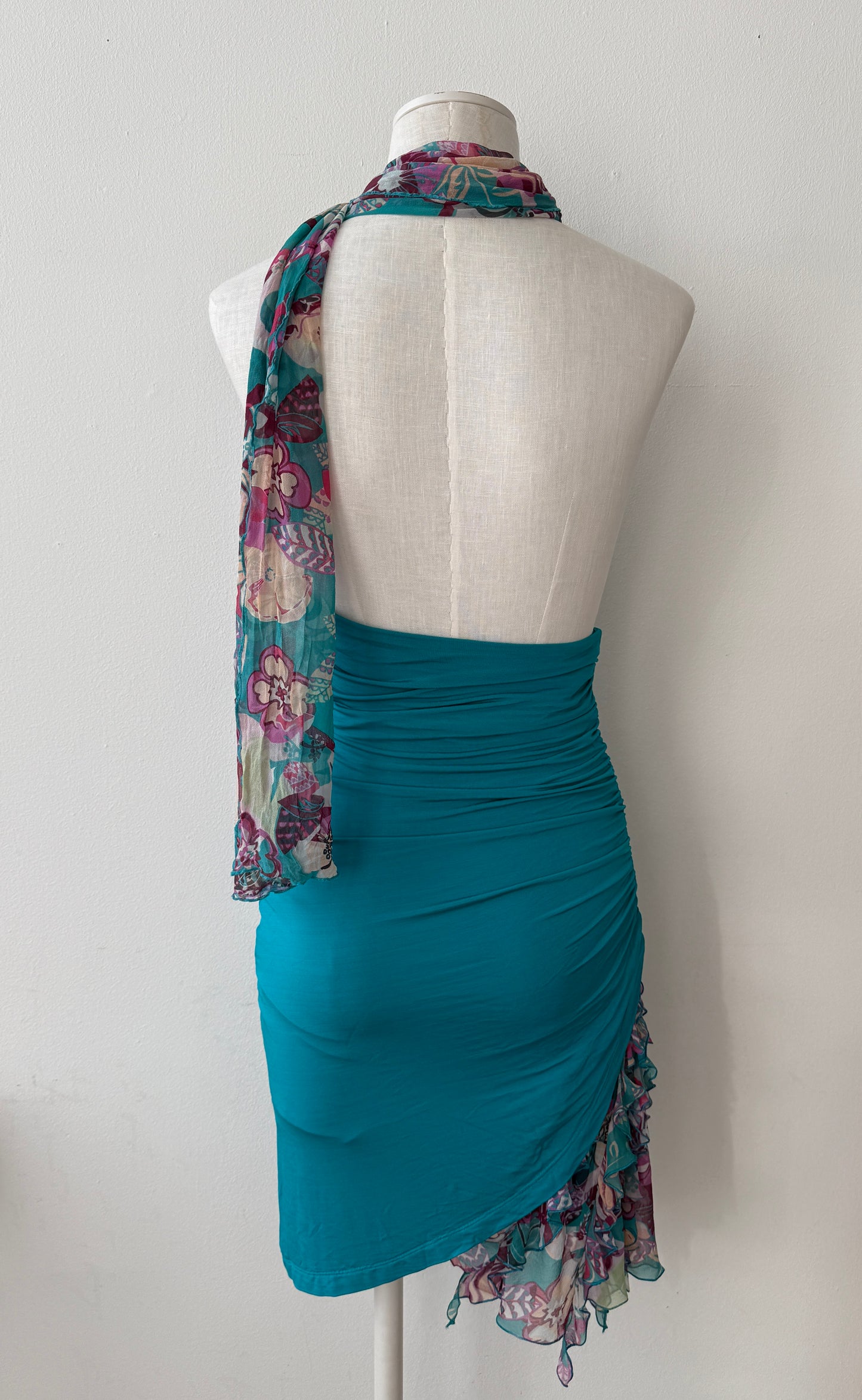 View of the Emanuel Ungaro Fuchsia Bodycon Dress without a scarf on a mannequin from the back