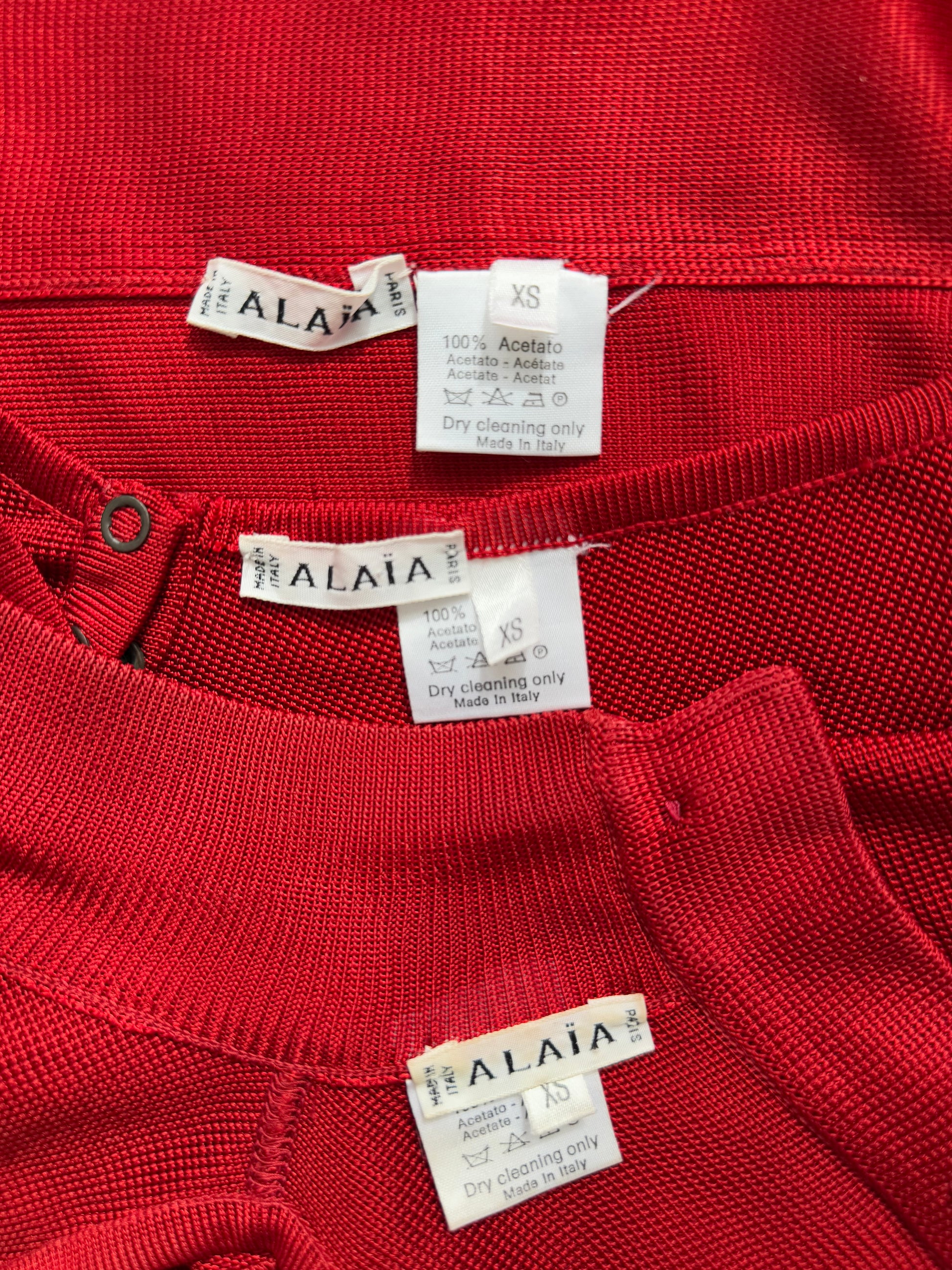 Azzedine Alaia 1986 brand and size tag detail from vintage red skirt and bodysuit set.
