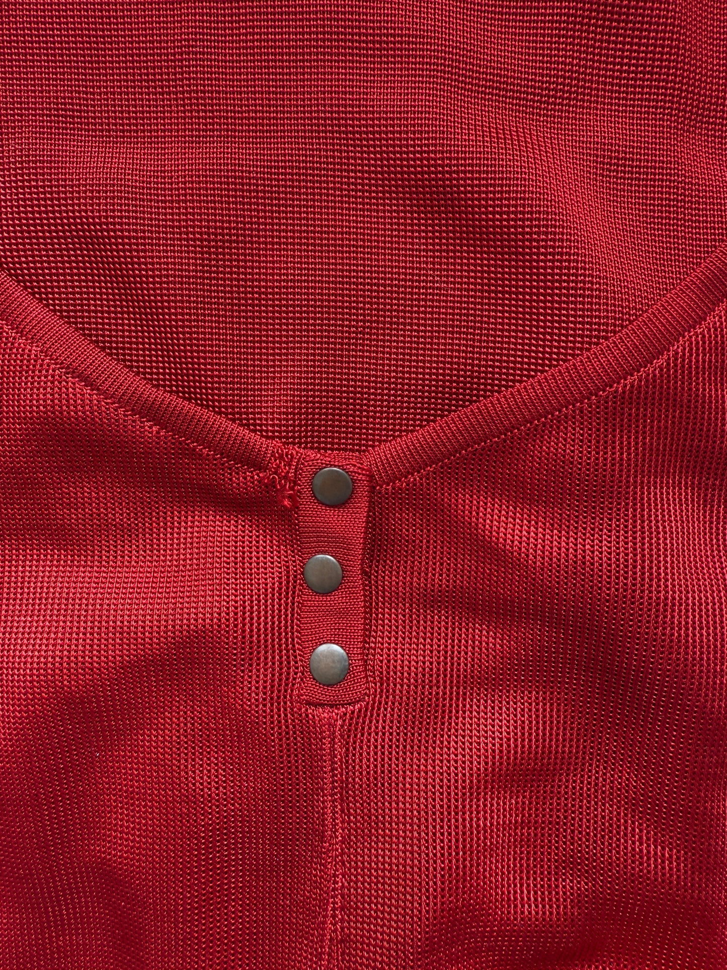 Azzedine Alaia 1986 lace-up detail from vintage red skirt and bodysuit set.