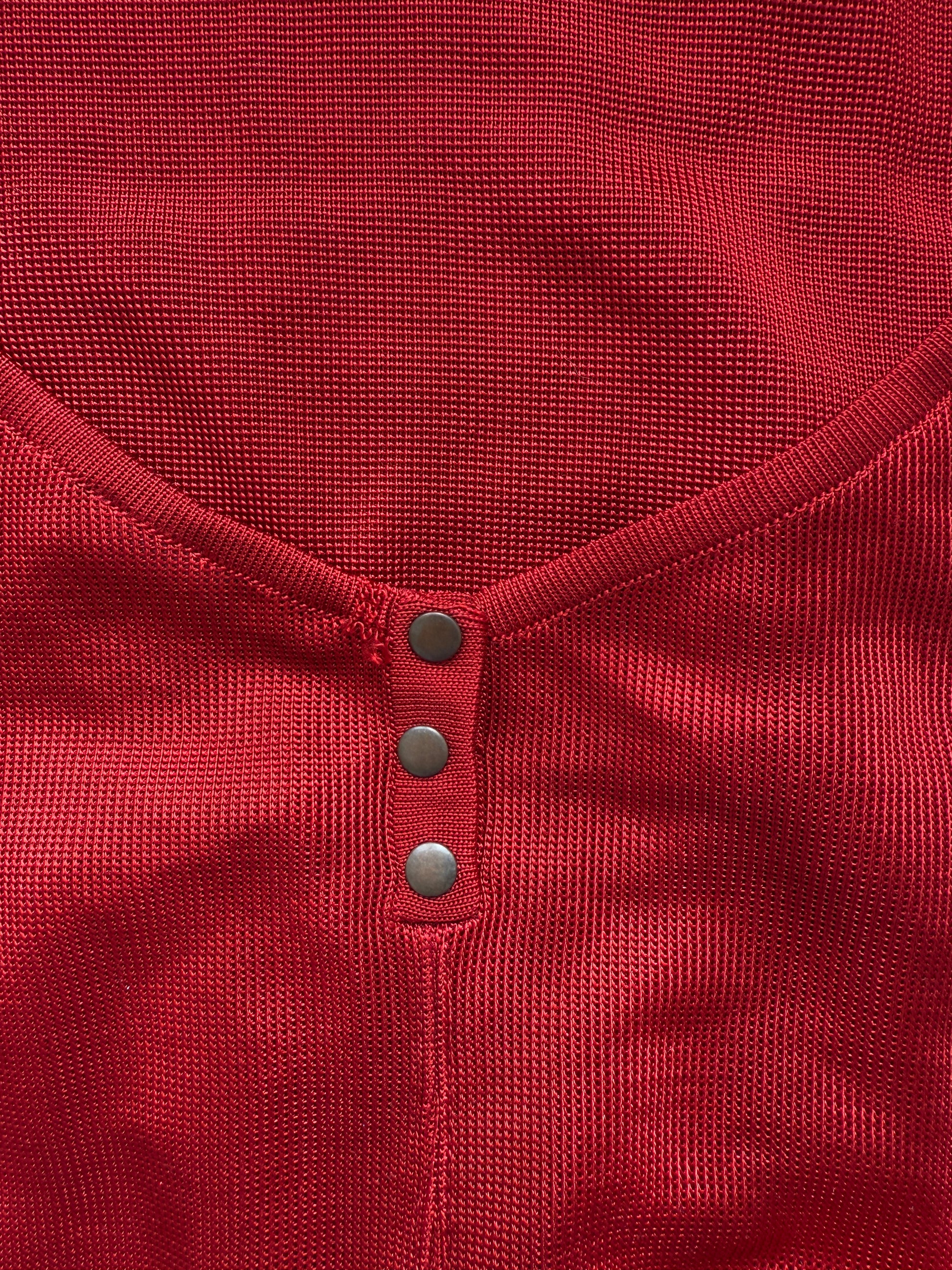 Azzedine Alaia 1986 lace-up detail from vintage red skirt and bodysuit set.