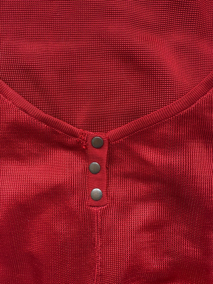 Azzedine Alaia 1986 lace-up detail from vintage red skirt and bodysuit set.