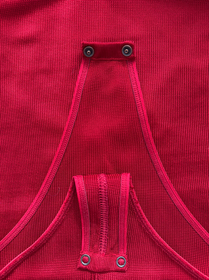 Azzedine Alaia 1986 lace-up detail from vintage red skirt and bodysuit set in size XS.