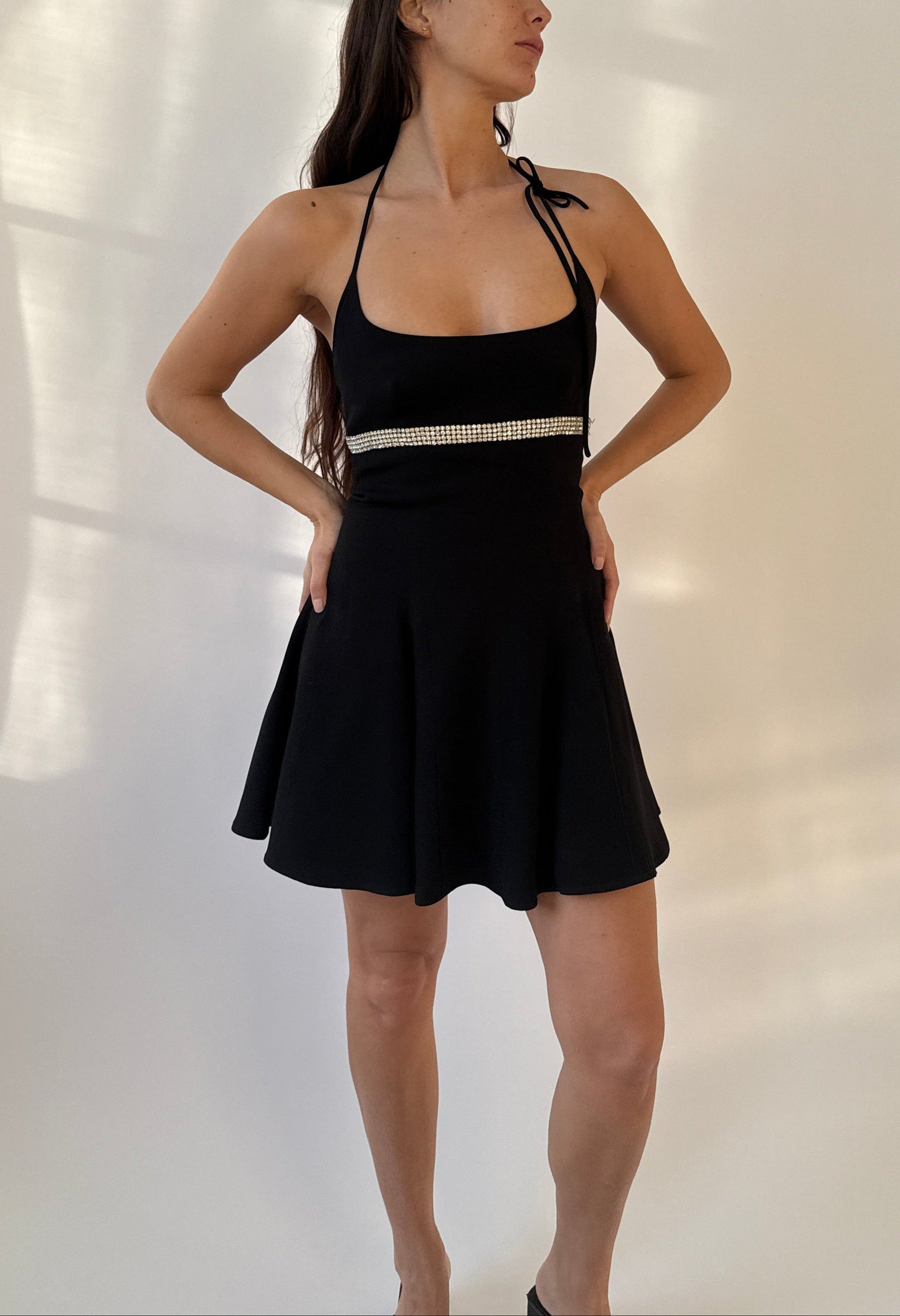 A model wearing the Dolce & Gabbana 1995 Rhinestones Halter Dress photographed from the front in full length.