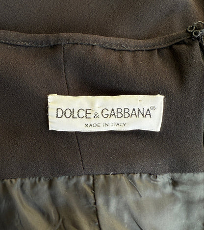 A close-up of the brand label of the Dolce & Gabbana 1995 black halter dress