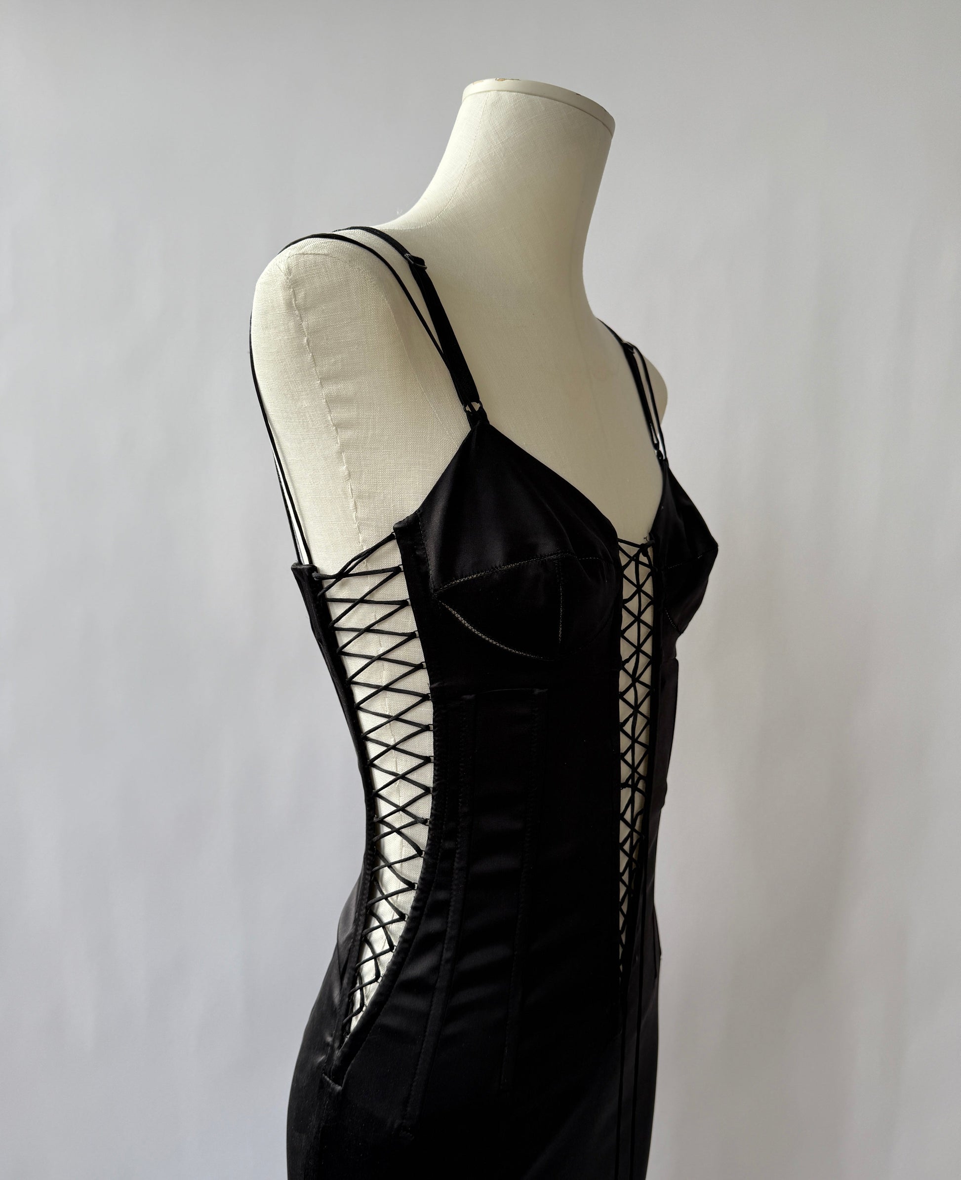 Zoomed photo of the Dolce & Gabbana 2003 Lace up Dress viewed from the side on a mannequin