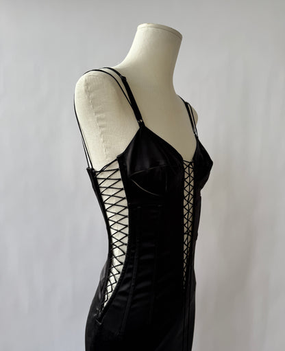 Zoomed photo of the Dolce & Gabbana 2003 Lace up Dress viewed from the side on a mannequin