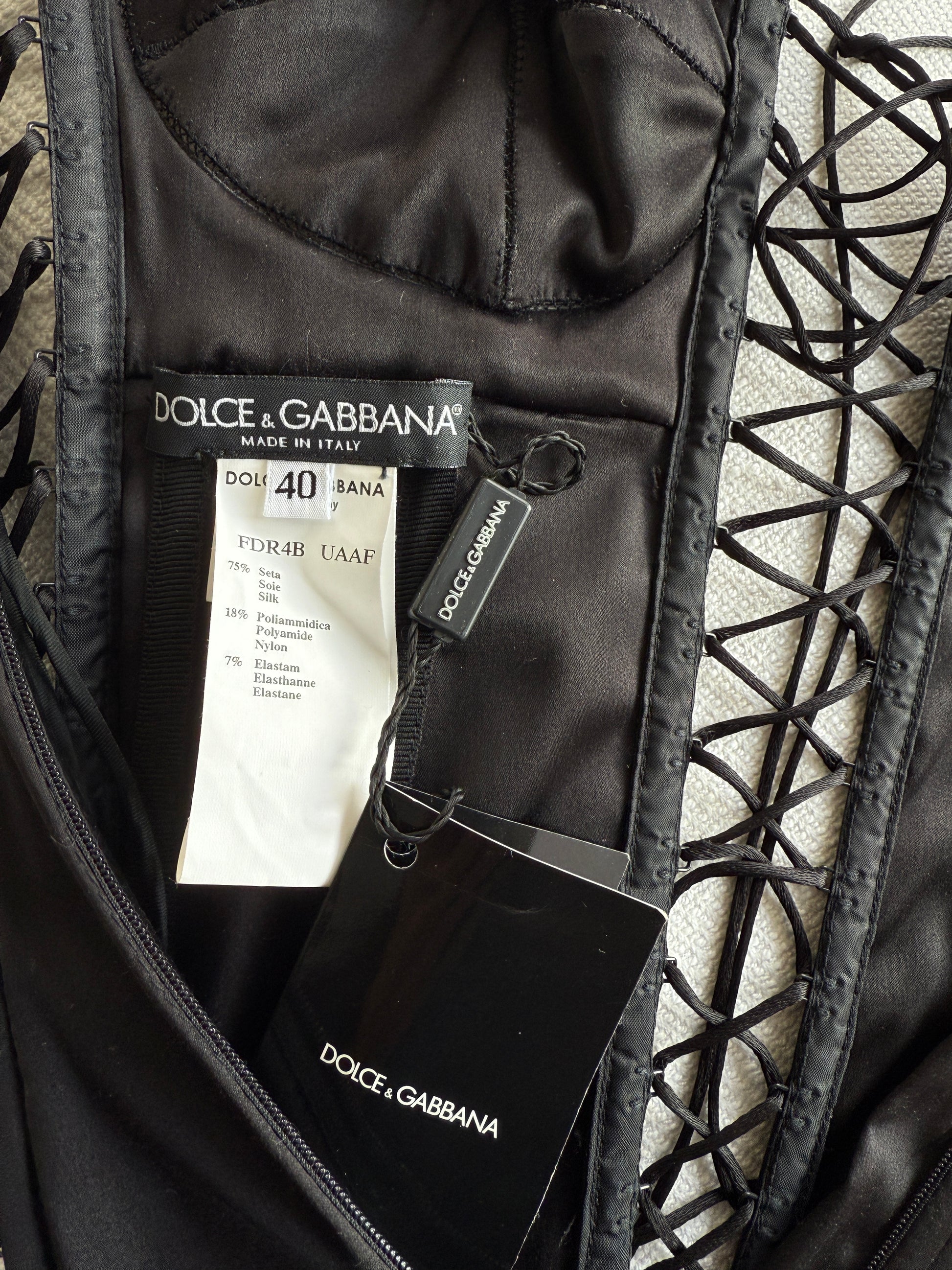 The brand and care label of the Dolce & Gabbana lace up dress