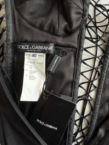 The brand and care label of the Dolce & Gabbana lace up dress