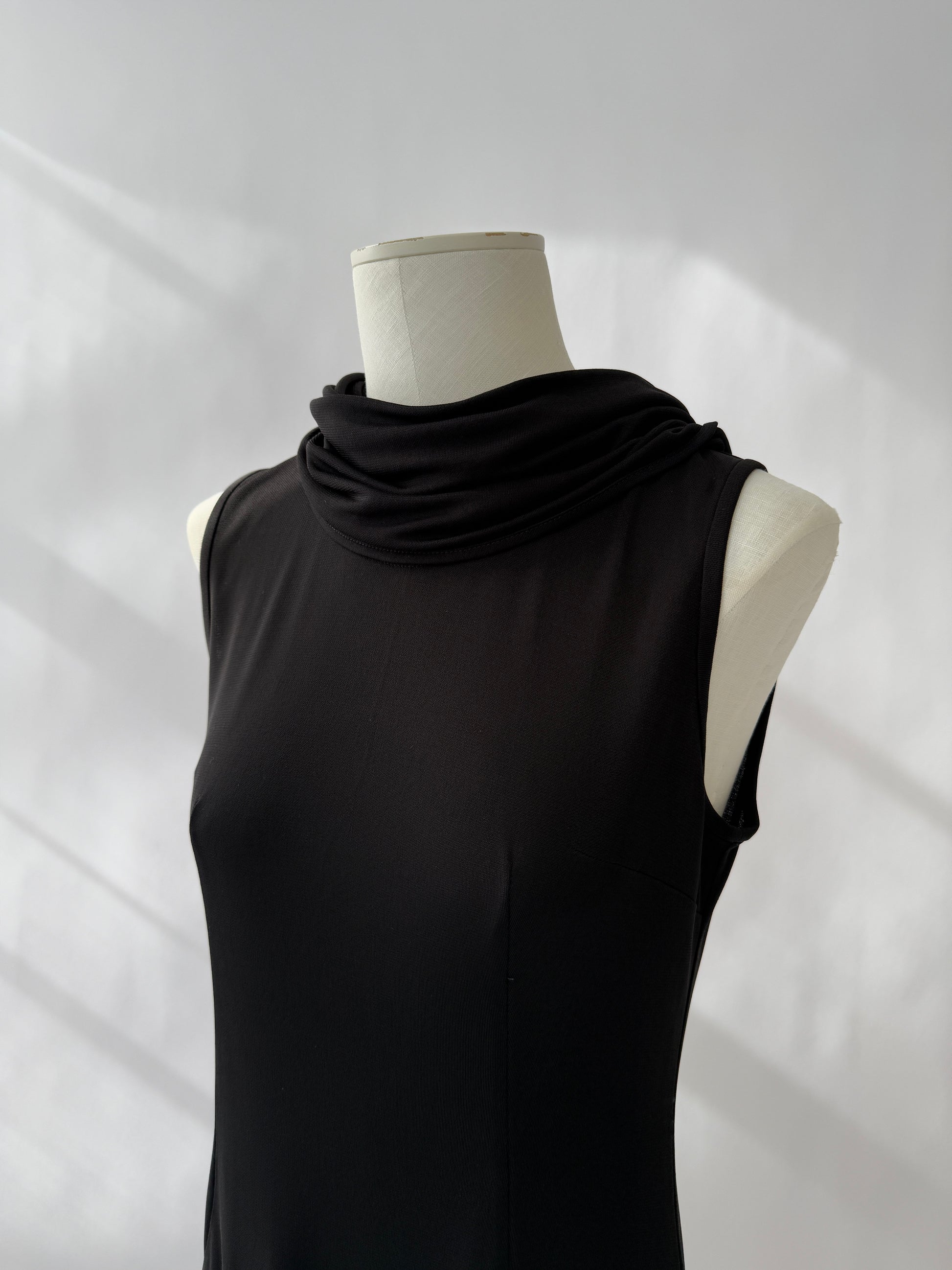 Close-up of the neckline of the Dolce & Gabbana 1996 Runway Hooded Mini Dress on a mannequin.