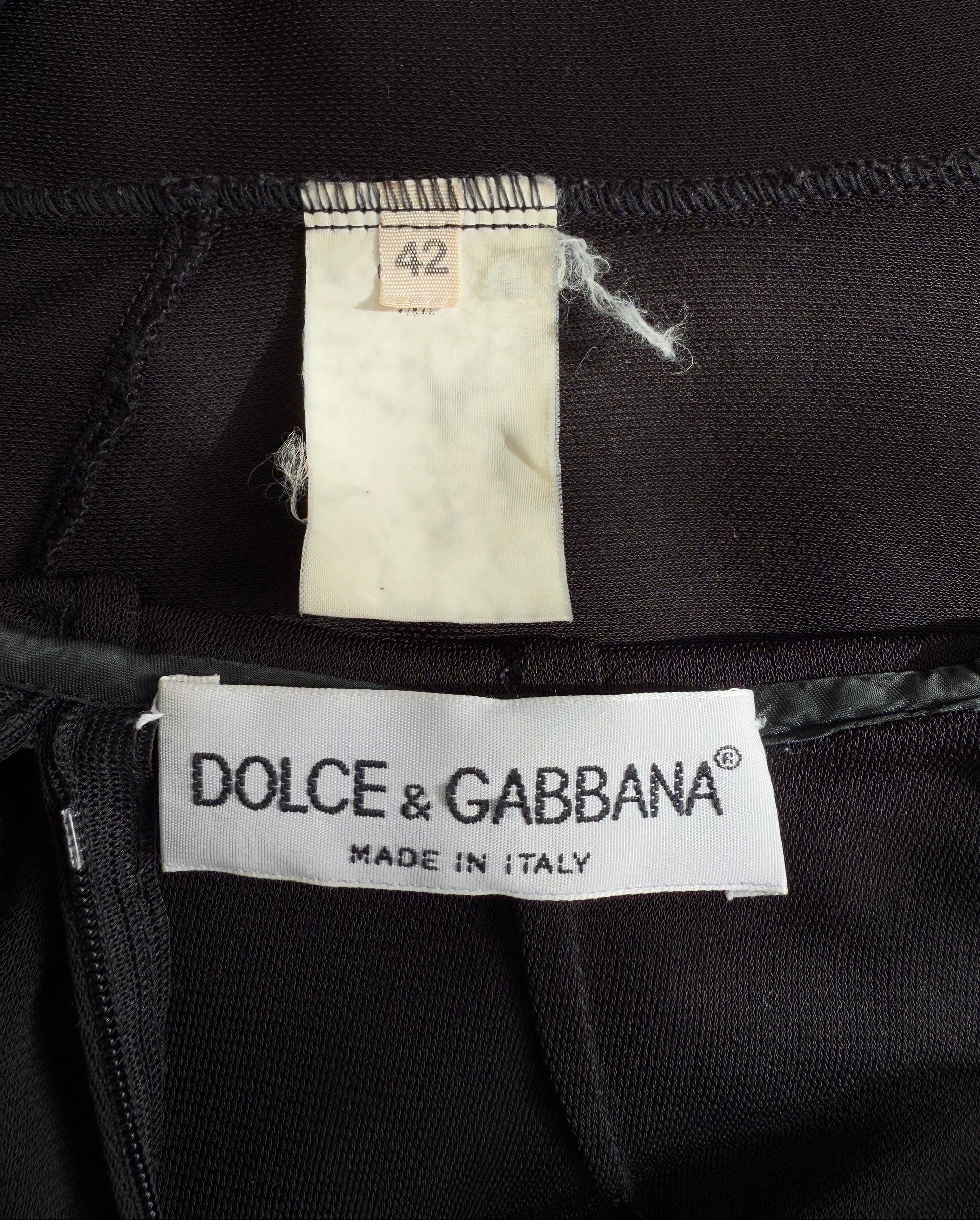 Close-up of the brand and size tag of the Dolce & Gabbana 1996 Runway Hooded Mini Dress.