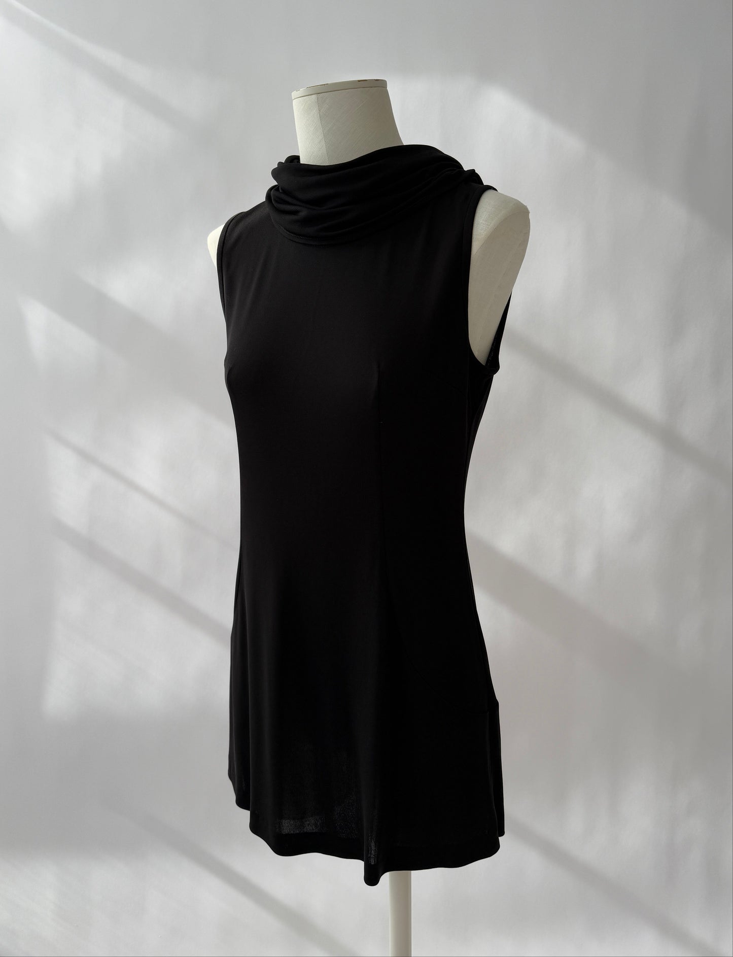 The Dolce & Gabbana 1996 Runway Hooded Mini Dress seen from the front on a mannequin.