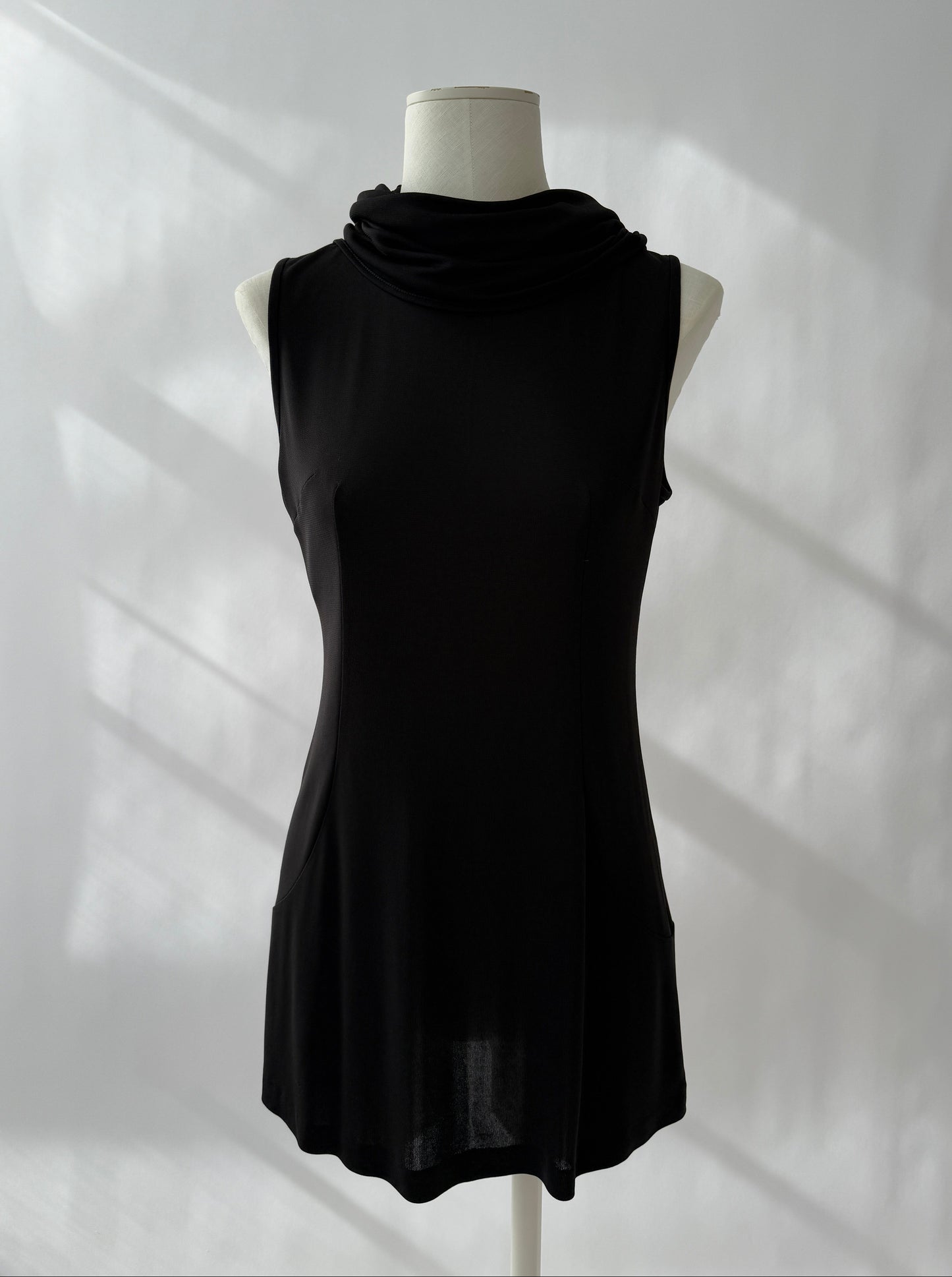 Full length photo of the Dolce & Gabbana 1996 Runway Hooded Mini Dress seen from the front on a mannequin.