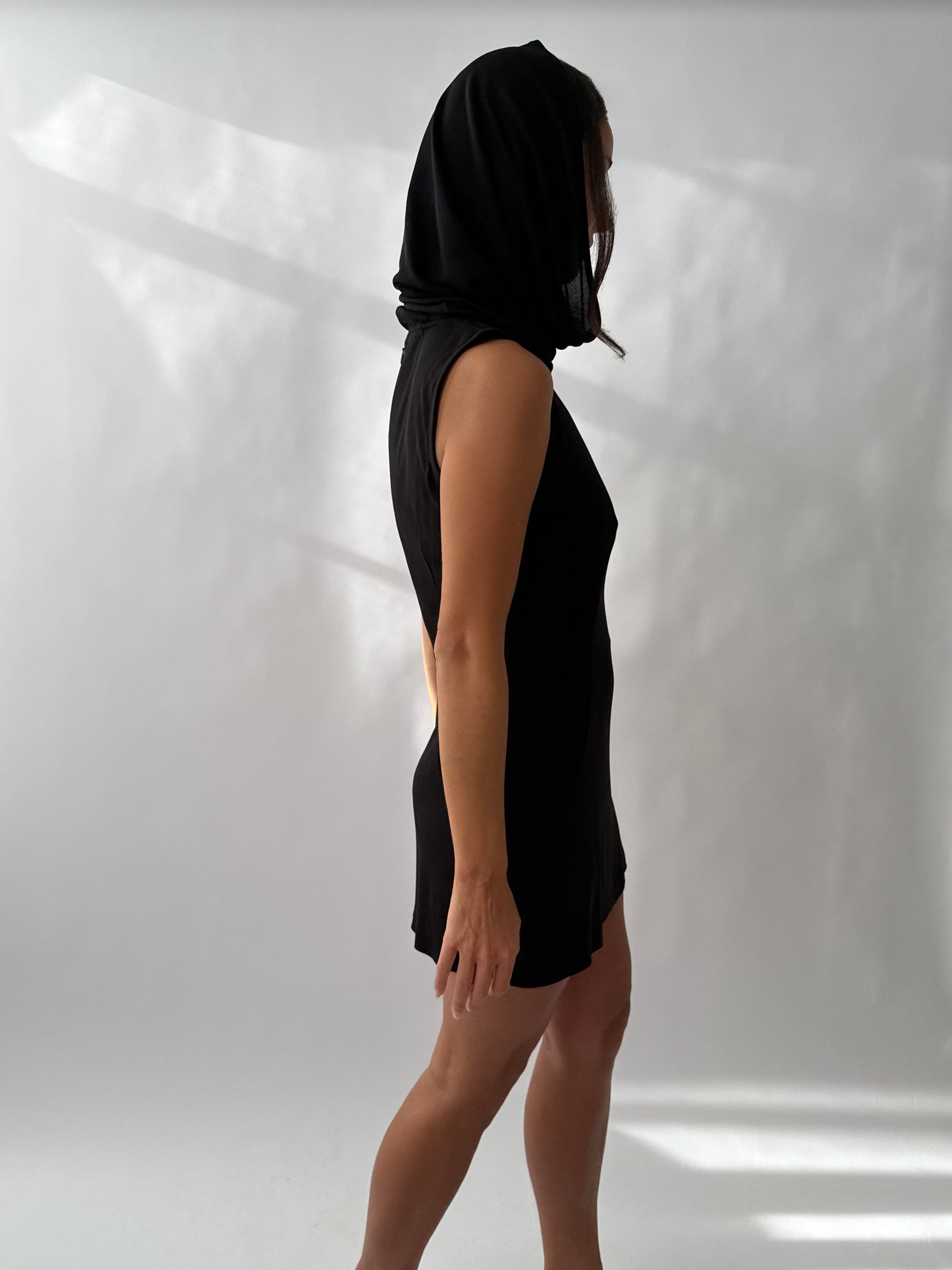 Side back view of the Dolce & Gabbana 1996 Runway Hooded Dress on a model.