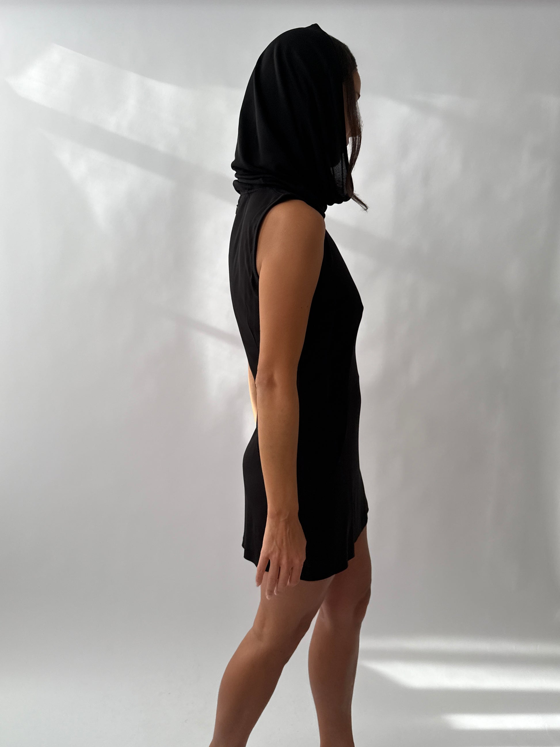 Side back view of the Dolce & Gabbana 1996 Runway Hooded Dress on a model.