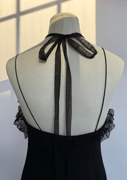 A detail photo of the back of the Emanuel Ungaro silk haler dress, showcasing the halter neck silk bow strap detail.