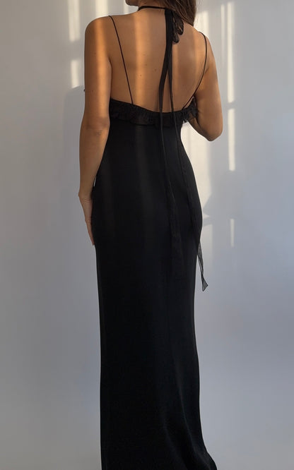 Full length back view of the Emanuel Ungaro 2000's black silk ruched dress on a model.