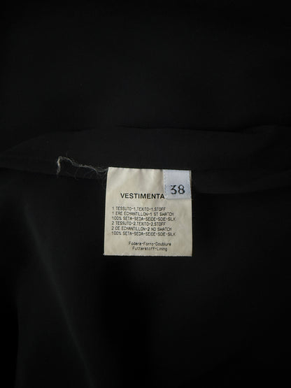 Zoomed in detail photo of the size and care of the Emanuel Ungaro silk halter neck gown.