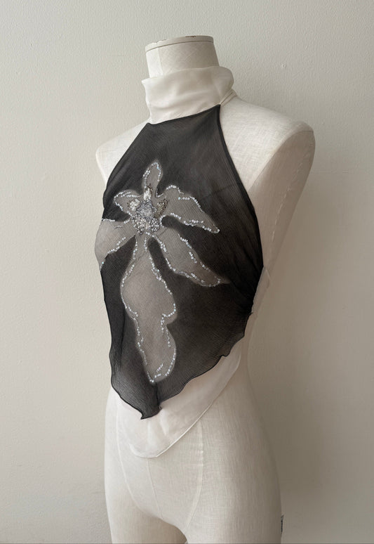 Side front view of the Emanuel Ungaro Silk Halter Top with an open back on a mannequin