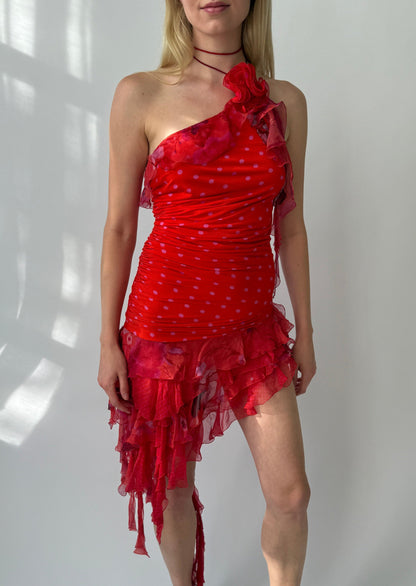 Emanuel Ungaro Spring/Summer 2003 ruffle halter silk dress in red with pink polka dots, displayed front-on. Features asymmetrical layered ruffles cascading from a halter neckline and a removable floral brooch at the shoulder.