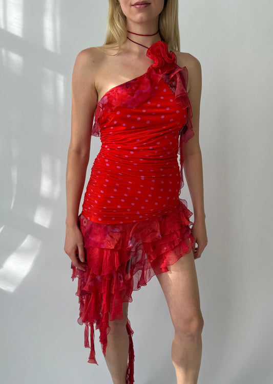Emanuel Ungaro Spring/Summer 2003 ruffle halter silk dress in red with pink polka dots, displayed front-on. Features asymmetrical layered ruffles cascading from a halter neckline and a removable floral brooch at the shoulder.