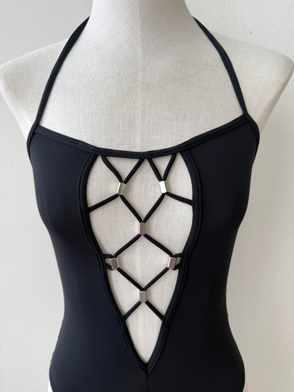 A close-up detail shot of the plunging neckline of the Paco Rabanne Vintage Swim Suit viewed from the front