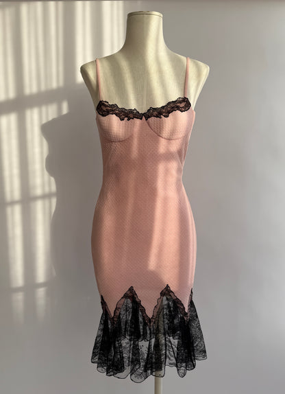Vintage Versace S/S 2002 dress displayed on mannequin – pink bodycon with lace hem.