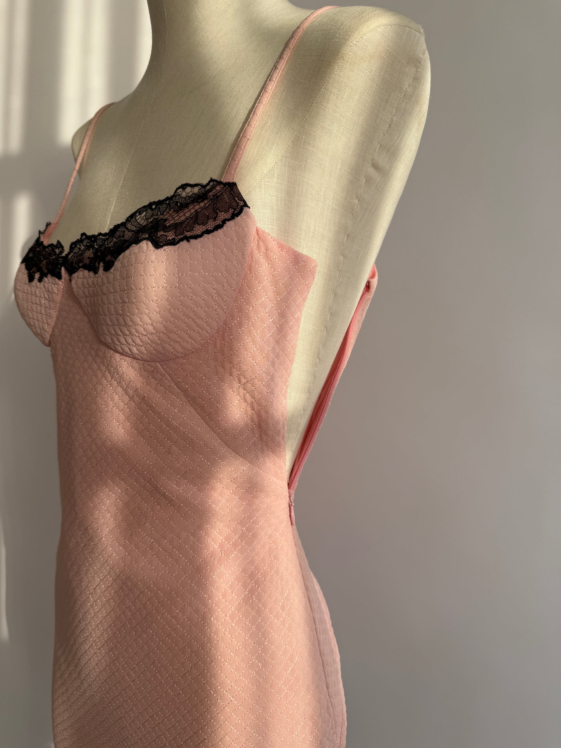 Detail shot of the zipper of the Versace pink dress from the S/S 2002 collection.