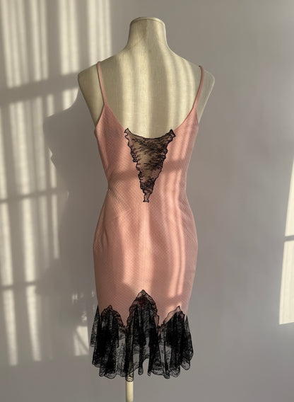 Back view of vintage Versace 2002 dress showing open back and lace fishtail hem.