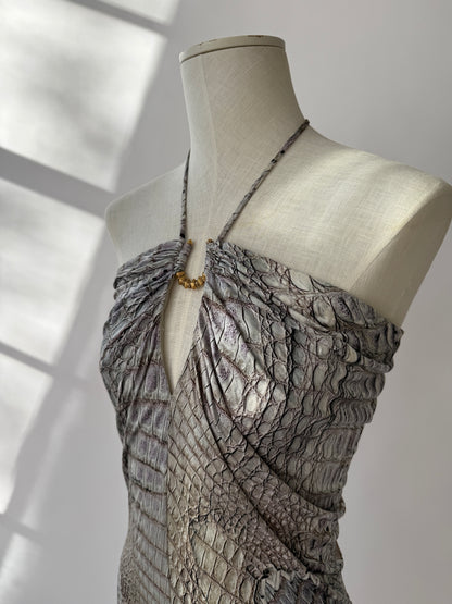 Cavalli 2011 crocodile print dress shown from the side on a mannequin showing the peephole design and halter strap.