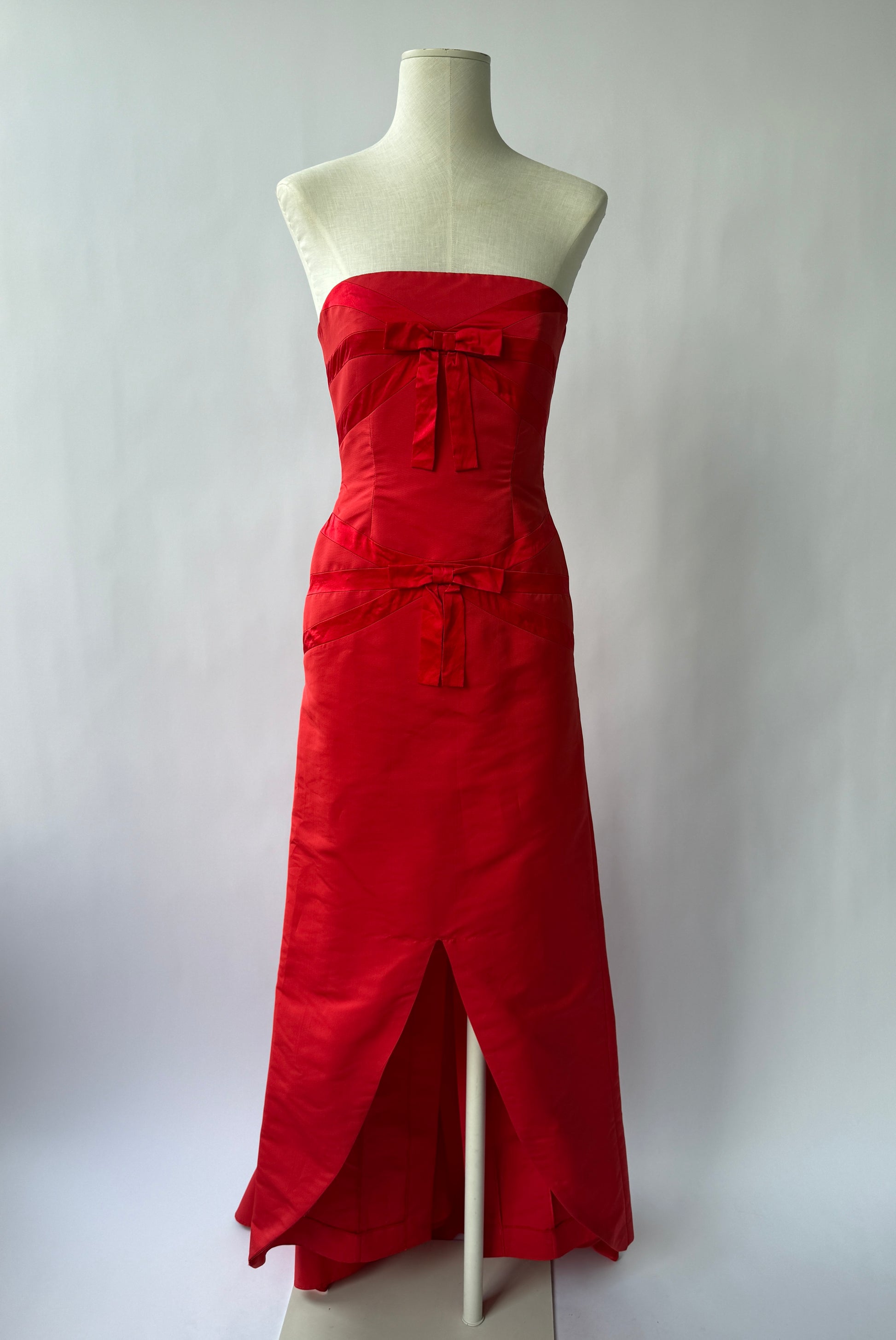 Full length front view photo of the Valentino vintage Strapless Red Bow Gown on a mannequin