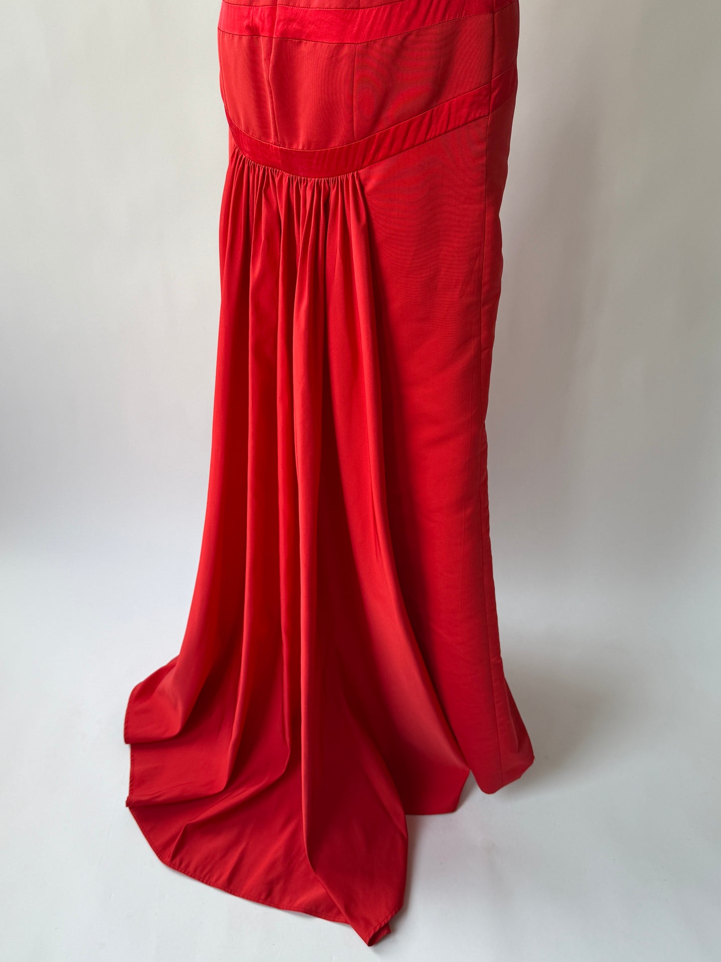 Close up of back of the skirt of the vintage Valentino Strapless Red gown on a mannequin