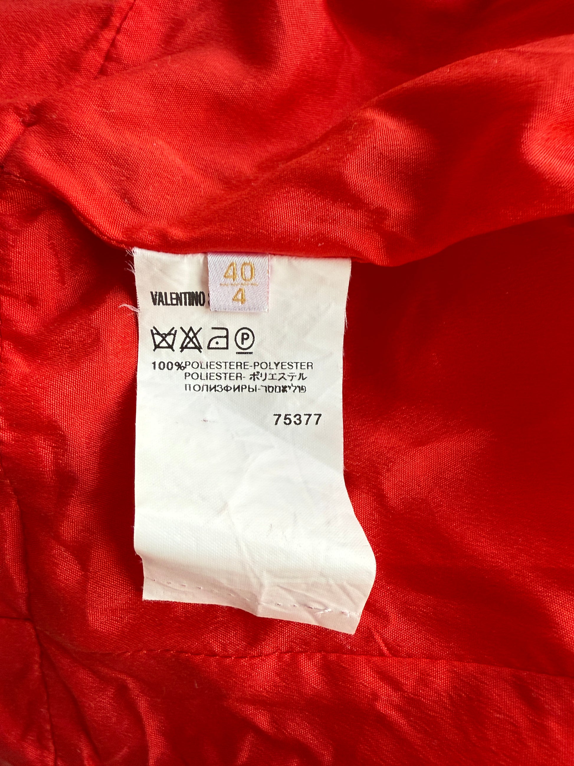 Detail photo of the care label of the vintage Valentino red gown
