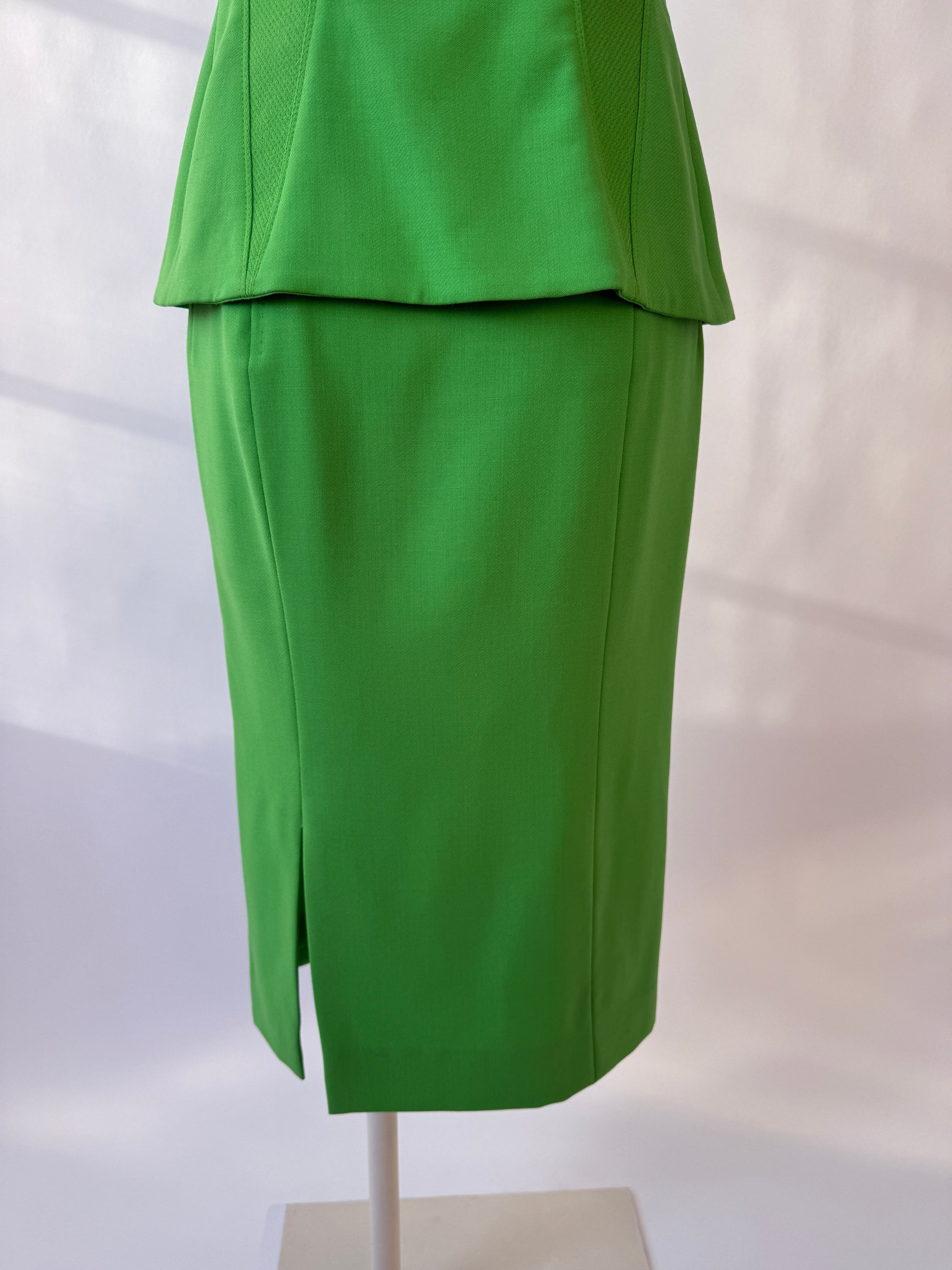 Close-up of the back of the Versace 1993 skirt on a mannequin agains a white background.
