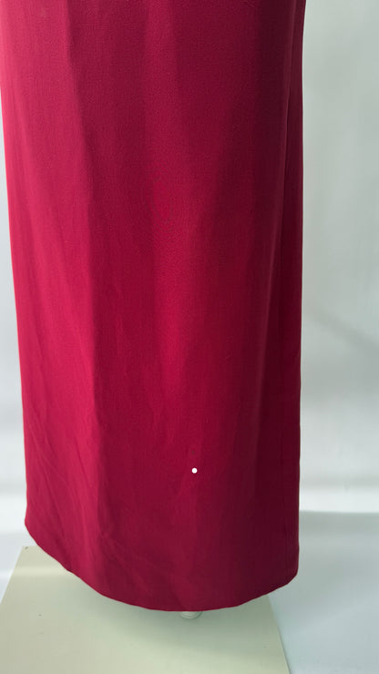 A close-up photo of the fabric of the skirt from the vintage red embellished Versace Gown.