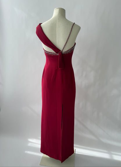 Full length photograph of the Versace 1998 Red Rhinestone Embellished Gown viewed on a mannequin from the back.