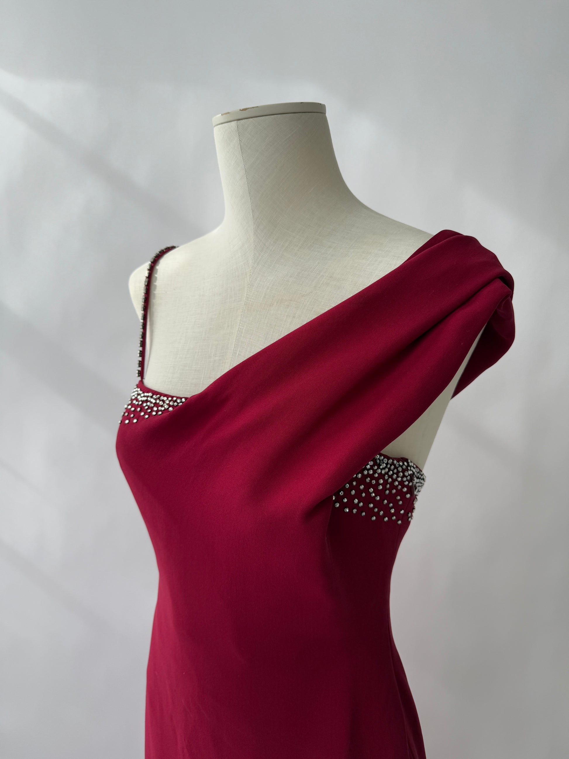 Detail photograph of the neckline of the Versace Red Rhistone Gown.