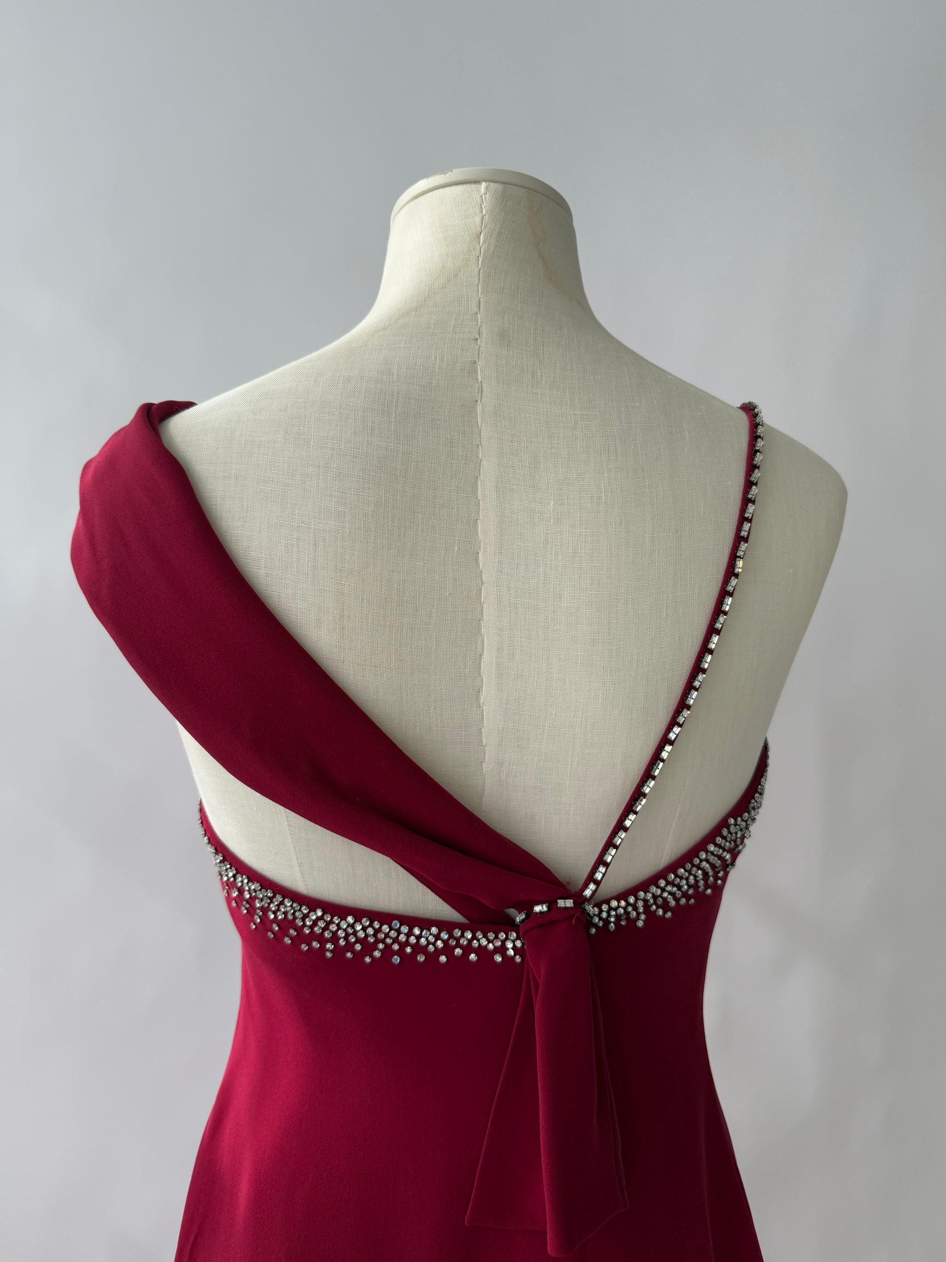 Detail photo of the top of the Versace Embellished Gown, showcasing the rhinestones on the shoulder strap.